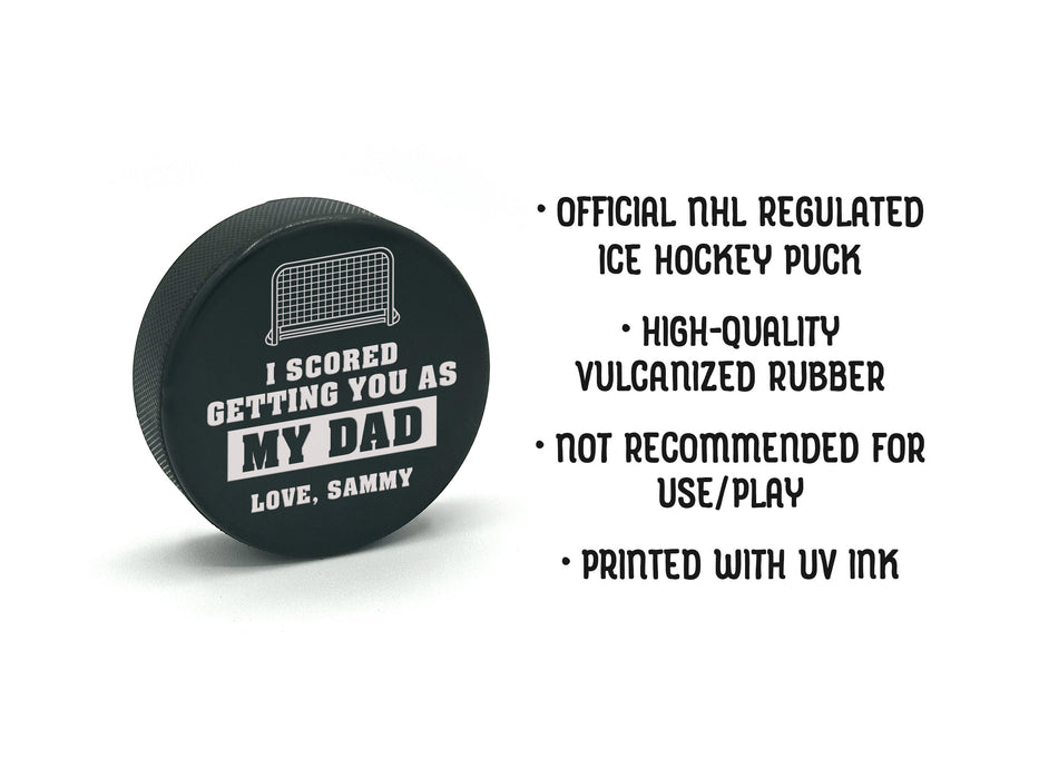 item details are written out next to hockey puck with I scored you as my dad design

official NHL regulated ice hockey puck, high-quality vulcanized rubber, not recommended for use and play, printed with UV ink