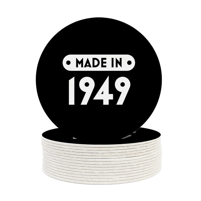 A single coaster is shown on top of a stack of other coasters. Coasters are designed with a custom year. Coasters read MADE IN 1949 and designed with white text and black background.