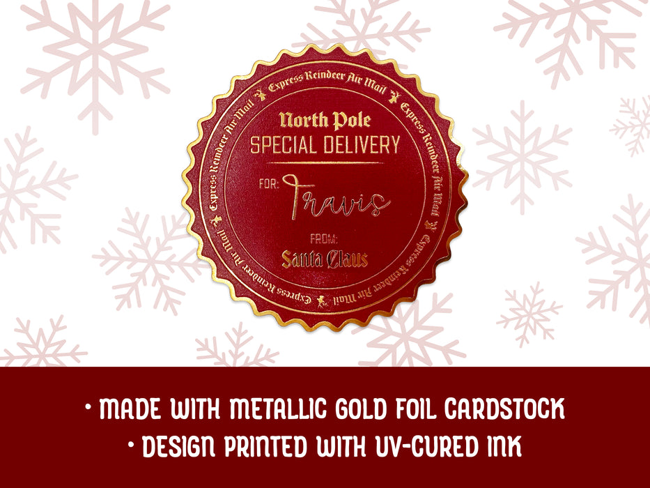 A gold foil cardstock Santa gift tag is shown on a white background with red snowflakes. Text underneath the tag reads: Made with metallic gold foil cardstock, Design printed with UV-cured ink.