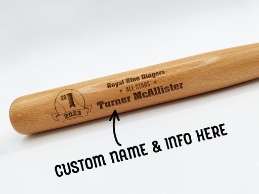 wooden mini baseball bat with custom laser engraved design that features a baseball team design with a team name and says "#1 2023, Royal Blue Dingers, All Stars, Turner McAllister" on a white surface with An arrow and text that says Custom Name & Info Here