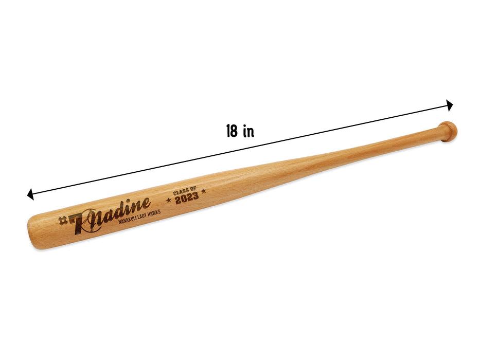 bat measures 18 inches wooden mini baseball bat with custom laser engraved design that features a name with a baseball with a number and says "#7 Nadine, Nanakuli Lady Hawks, class of 2023" on a white surface