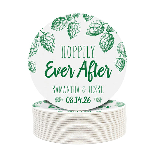 A stack of coasters with a single coaster on top shown on a white background. Coasters feature Hoppily Ever After design. This design uses green lettering and sketched drawings of beer hops. Wedding couples names and date can be customized.
