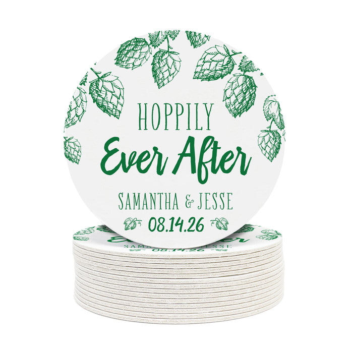 A stack of coasters with a single coaster on top shown on a white background. Coasters feature Hoppily Ever After design. This design uses green lettering and sketched drawings of beer hops. Wedding couples names and date can be customized.