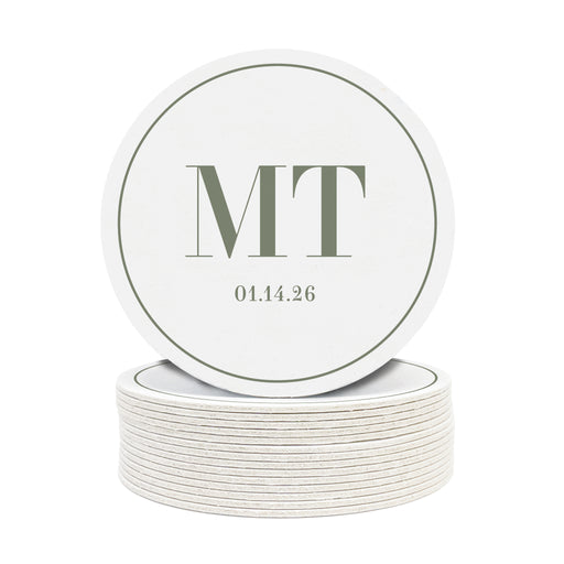 A stack of custom round coasters against a white background. Coasters feature a personalized monogram design with a couple's first name initials and date.