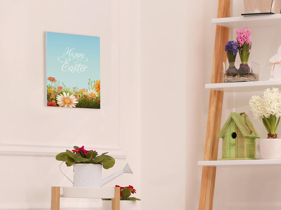 8x10 canvas of happy easter artwork of a spring meadow on a white bedroom wall surrounded by easter decor such as potted plants, bird houses, and a white wooden bunny statue