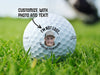 Titleist golf ball is shown on a grassy golf course. Ball features a custom face and the text I'm not lost... I'm hiding from Pierce. Arrow and text above ball reads customize with photo and text