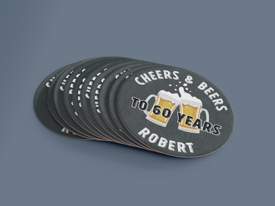 Stack of coasters with one on top. Coasters say Cheers & Beers to 60 Years Robert!