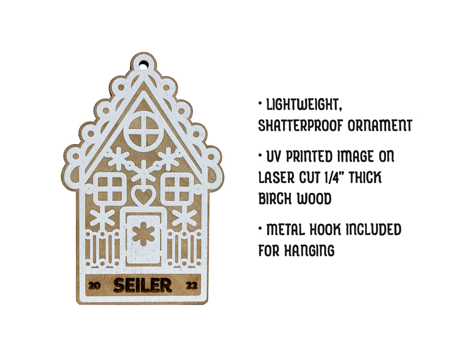 Ornament with Gingerbread House design is shown. Text reads: Lightweight, shatterproof ornament, UV printed image on laser cut 1/4 inch thick birch wood, Metal hook included for hanging