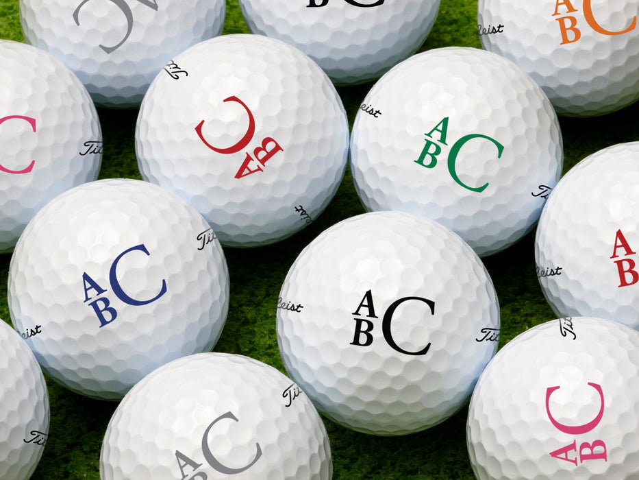 Multiple golf balls shown with stacked monogram design in all available colors.