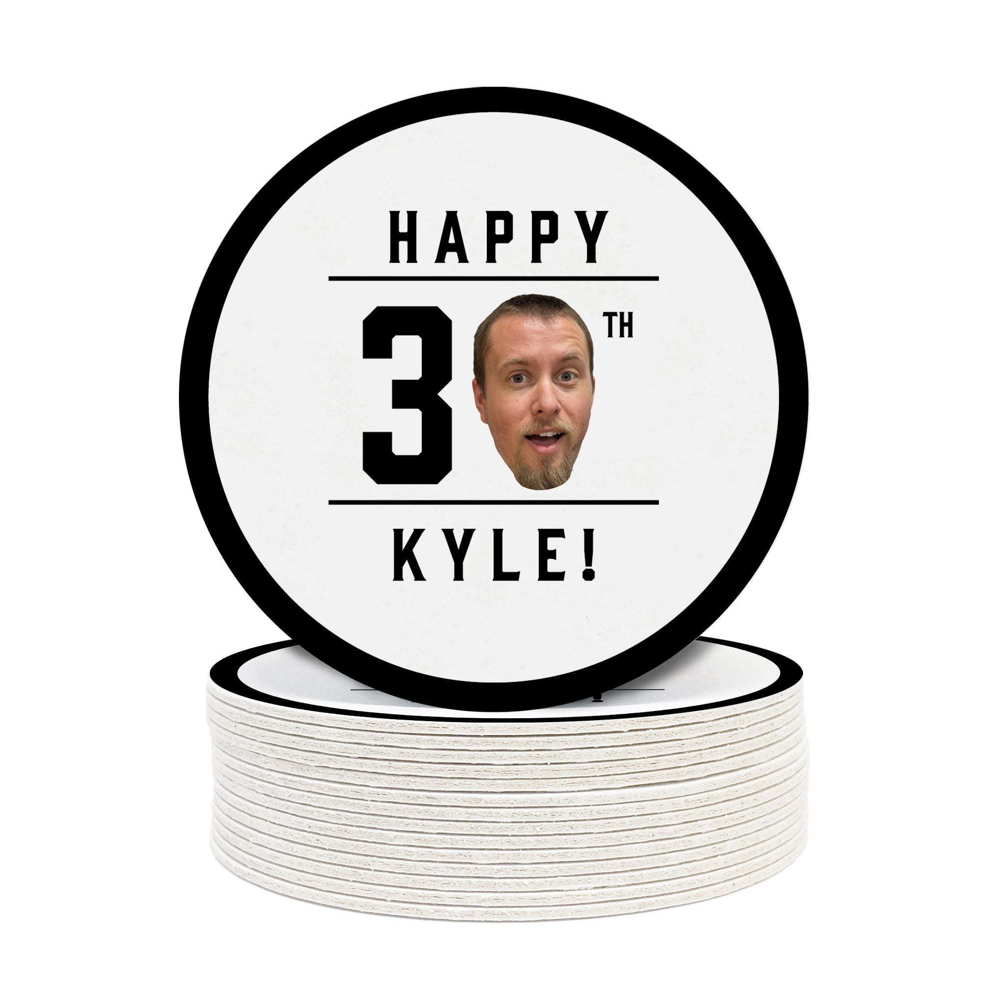 A single coaster is shown on top of a stack of other coasters. Coasters are shown with custom face and text design. Coasters read Happy 30th Kyle! Coasters are designed with black text and a custom face photo.