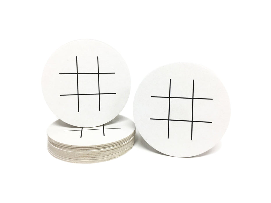 Single coaster is shown on top of a stack of coasters with another coaster sitting next to it on a white background. Coasters feature Tic Tac Toe design. This design has a tic tac toe game printed in black on white coasters.