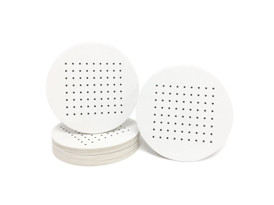 Single coaster is shown on top of a stack of coasters with another coaster sitting next to it on a white background. Coasters feature Dots and Boxes Game design. This design has black dots printed on white coasters.