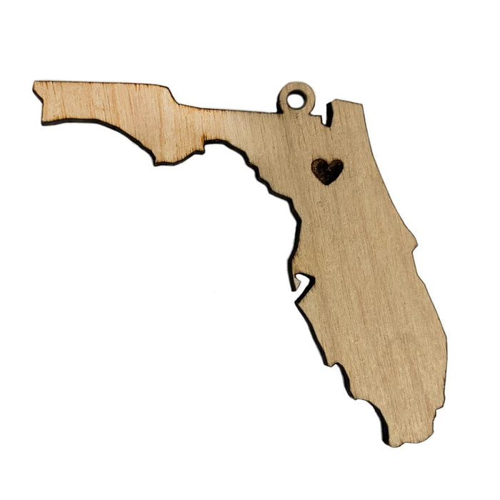 Ornament shown on white background. This ornament is made out of wood and is shaped as Florida. A heart is laser etched where chosen hometown or city would be.