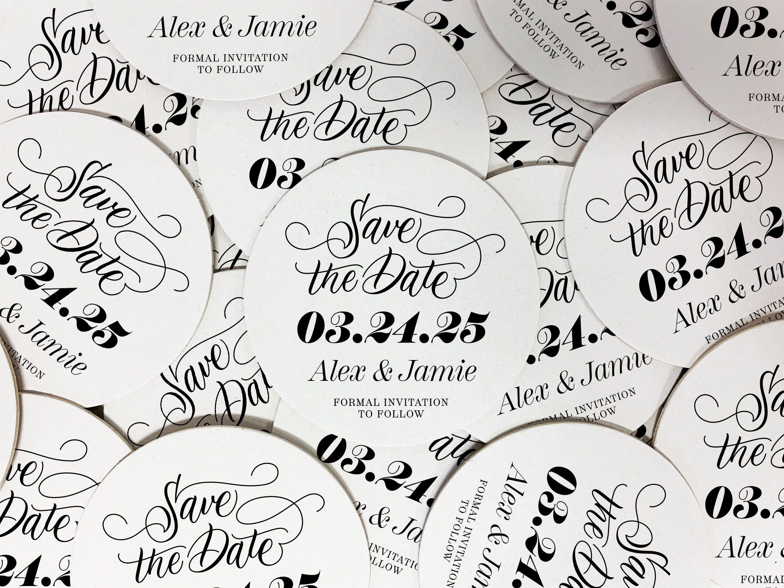 Stack of coasters with single coaster on top against a white background. Coasters say Save the Date, wedding date, married couple names, and formal invitation to follow.