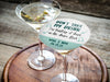 Personalized please don't take my drink coaster placed on top of martini glass on round wooden tray. Coasters say Don't take my drink, I'm busting it down on the dance floor. Married couple names are below with wedding date.