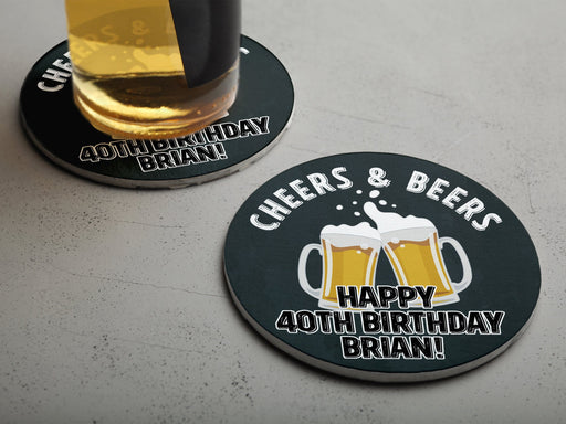 One coaster has a drink on it and an empty coaster sits beside it. Coasters say Cheers & Beers, Happy 40th Birthday Brian!