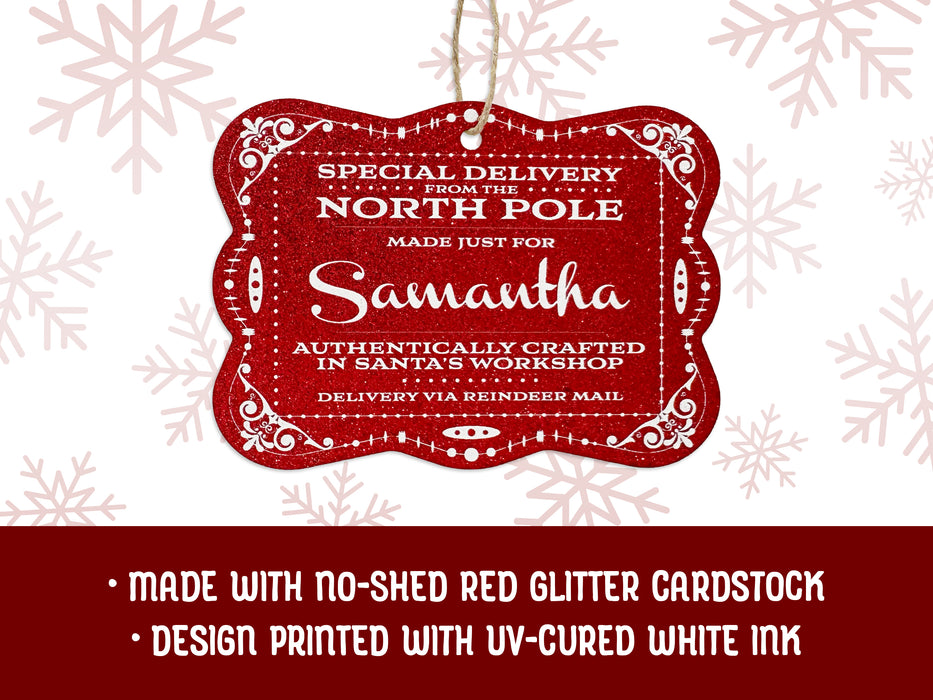 A red glitter hanging cardstock Santa gift tag is shown on a white background with red snowflakes. Text underneath the tag reads: Made with no-shed red glitter cardstock, Design printed with UV-cured white ink.