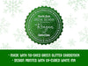 A green glitter cardstock Santa gift tag is shown on a white background with green snowflakes. Text underneath the tag reads: Made with no-shed green glitter cardstock, Design printed with UV-cured white ink.