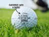 Single white Titleist golf ball with If Found, Hit Better Than design on golf course. The text "customize with a name" is above the ball with an arrow pointing toward it.