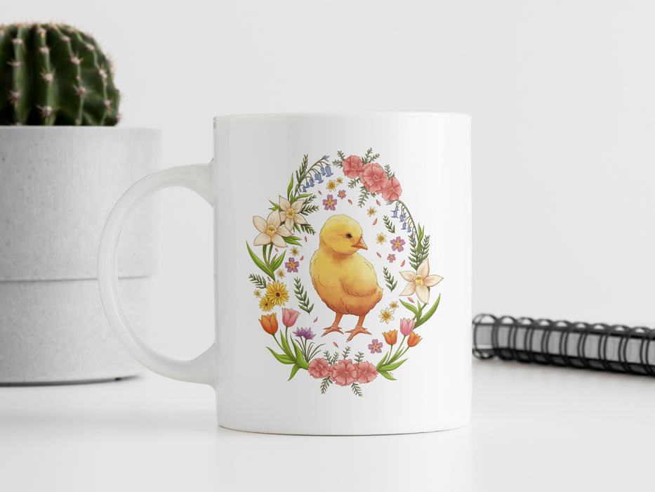 a white coffee mug with a yellow duck on it