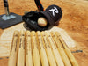 Personalized Mini 18 Inch Wood Baseball Bats shown on a homeplate. Multiple bats are shown with the baseball team design. Design features a jersey number, baseball illustration, player name, and team info.