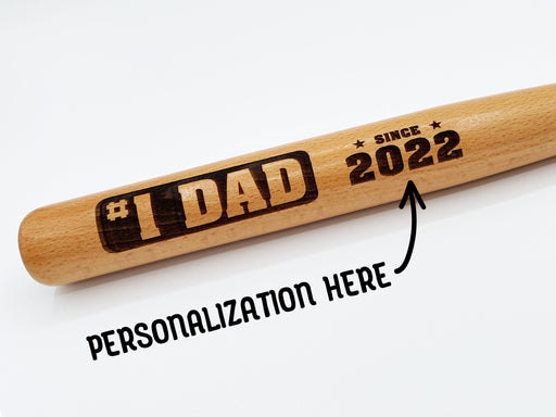 Photo of laser engraved #1 Dad mini bat design. Personalization is available for the year.