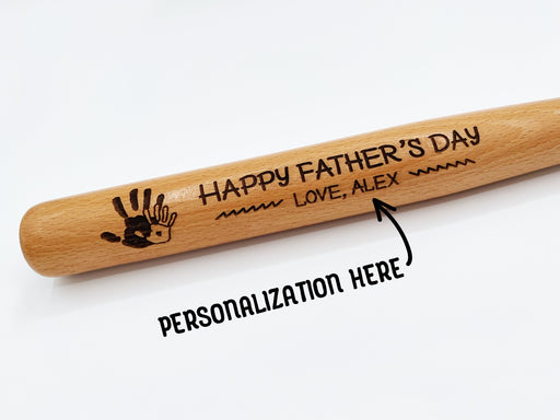 Photo of laser engraved Fathers Day Handprint mini bat design. Personalization is available for custom name.