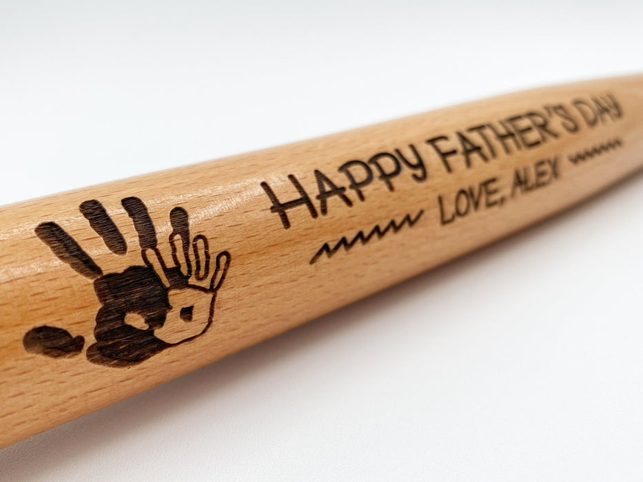 Close-up look of laser engraved Fathers Day Handprint mini bat design.