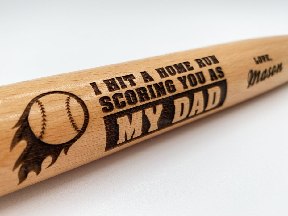 Close-up of Fathers Day Home Run laser engraved mini bat design.