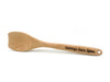 Laser engraved flat wooden spoon that says Grammys Sauce Spoon on handle against white background