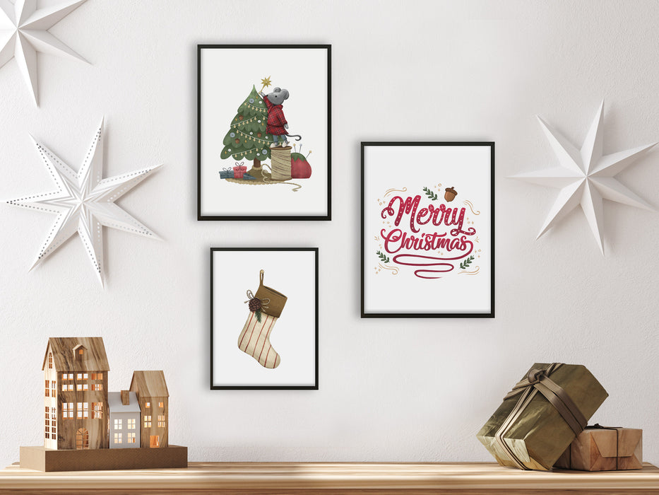 three framed christmas mice, stocking, and typography prints on white wall hanging over wooden counter surrounded by holiday decor such as white stars, gifts, mini wooden houses