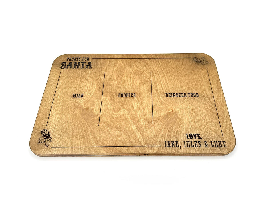 oak treats for Santa wooden cookie tray that says Treats for Santa, Love Gray & Asher, and says Milk, Cookies, and Reindeer food, surrounded by holly leaf designs