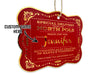 A hanging gold foil cardstock Santa gift tag is shown on a white surface. The text beside it reads, Custom Name Here.