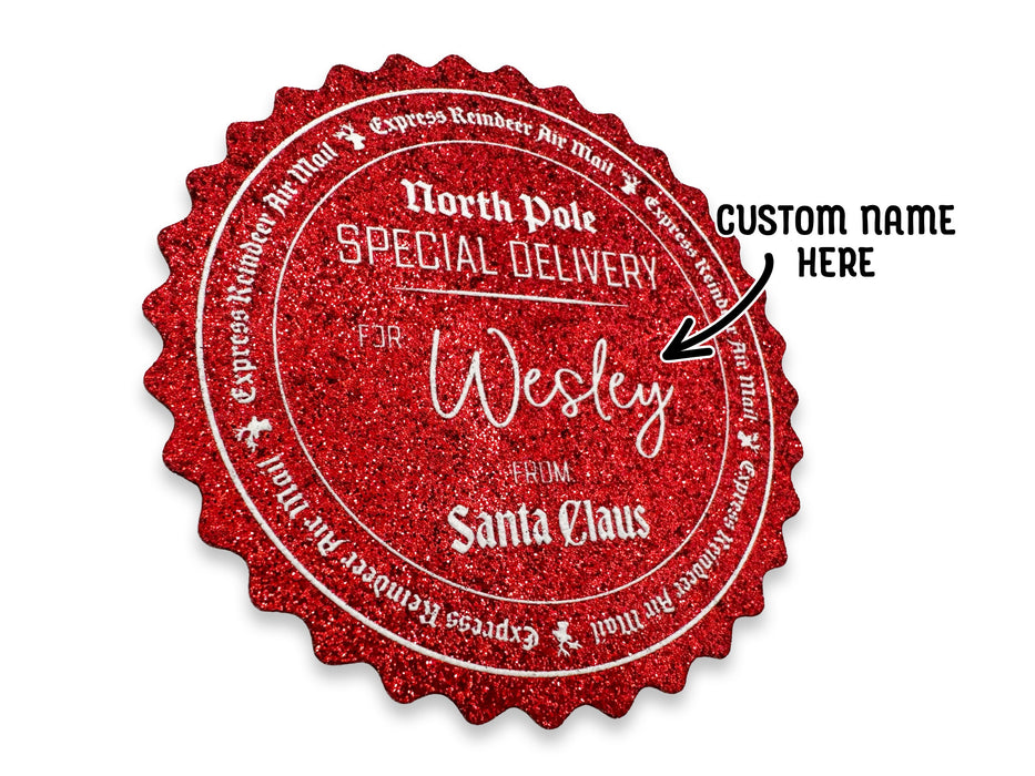 A red glitter cardstock Santa gift tag is shown on a white surface. The text beside it reads, Custom Name Here.