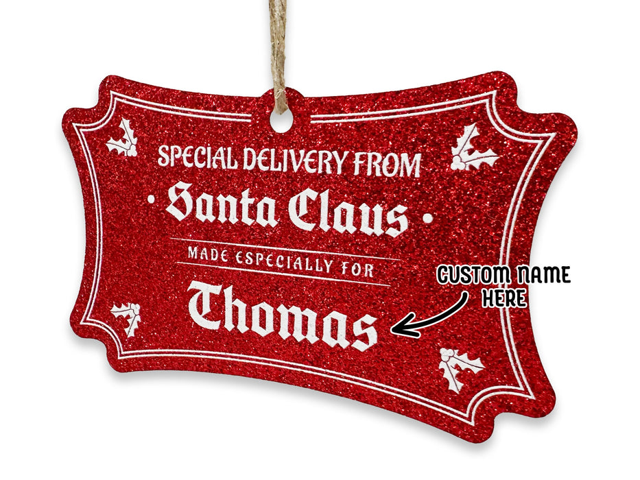 A hanging red glitter cardstock Santa gift tag is shown on a white surface. The text beside it reads, Custom Name Here.