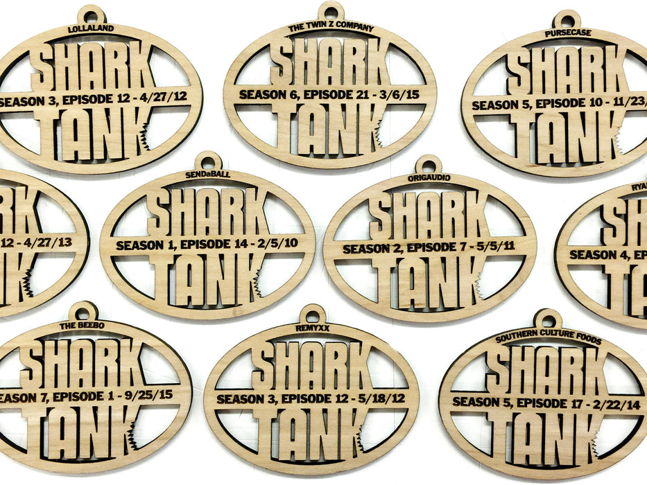 Custom wooden Shark Tank ornaments shown on a white surface.