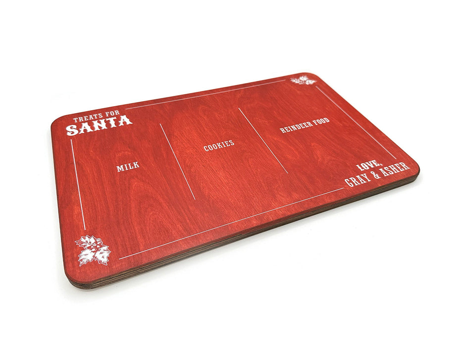 red treats for Santa wooden cookie tray that says Treats for Santa, Love Gray & Asher, and says Milk, Cookies, and Reindeer food, surrounded by holly leaf designs