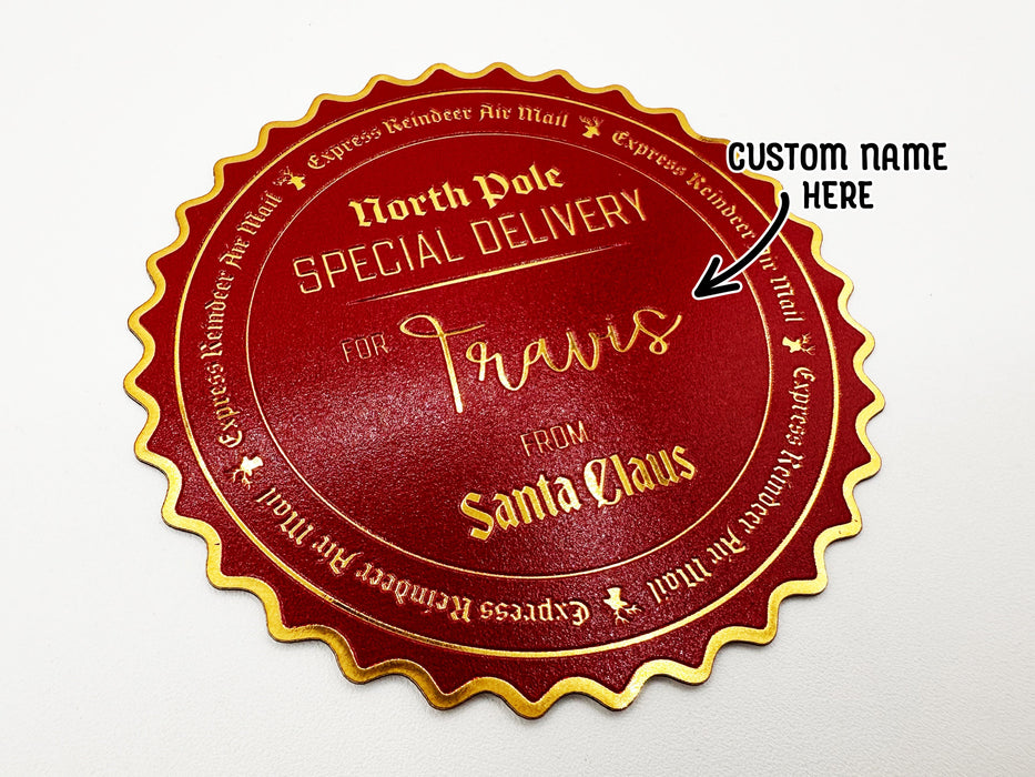 A gold foil cardstock Santa gift tag is shown on a white surface. The text beside it reads, Custom Name Here.