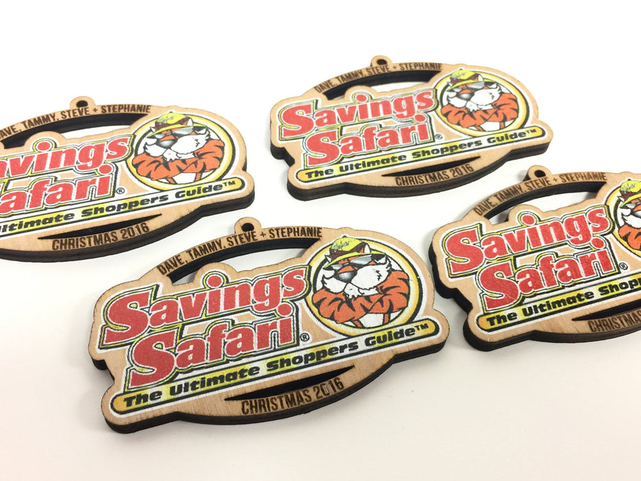 Four Savings Safari custom printed wood ornaments are shown on a white background.