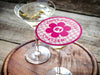 One coaster is shown being used as drink cover on top of a martini glass. Coasters are designed with hot and light pink ink. Coaster text reads Happy Birthday Chelsea with the number 21 in the center of a pink flower.