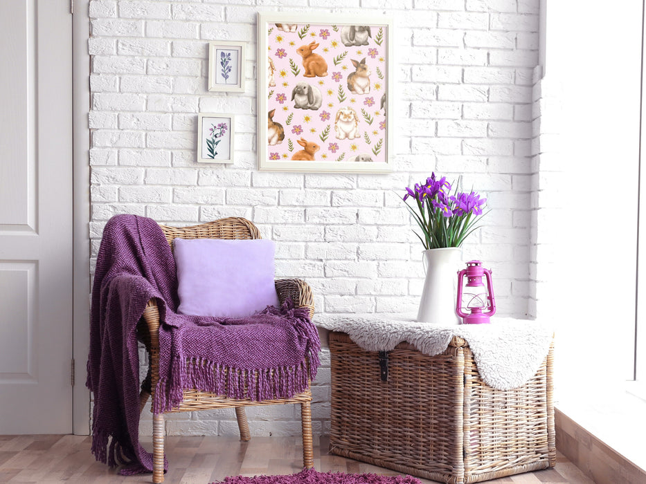 easter print of pastel bunny and flower pattern in a white frame on living room white brick wall surrounded by wall art, home furniture, and purple flowers in a vase