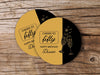 Two coasters are shown on a wooden surface. Coasters are designed in black and gold ink with cheersing champagne glasses. Coaster text reads Cheers to Fifty. Happy Birthday Diane.