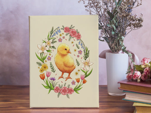 8x10 inch canvas with spring easter chick pastel easter art on wooden table surrounded by potted flowers, roses, and books in front of a purple wall
