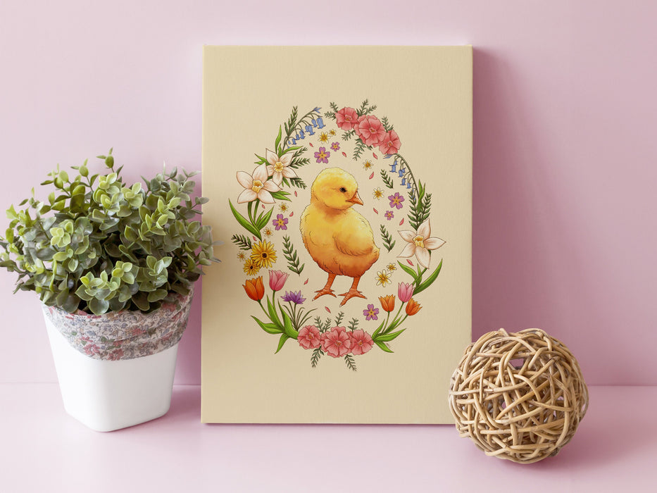 8x10 inch canvas with spring easter chick pastel easter art next to a wooden ball decor and potted plants in front of a pink wall