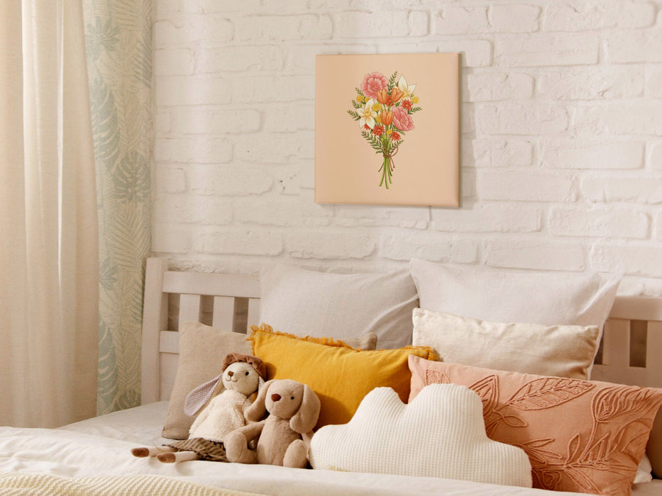 12x12 inch canvas with spring flowers pastel easter art on white brick wall hanging over bed in bedroom decorated with cute pillows and rabbit stuffed animals
