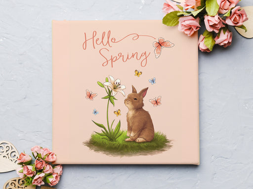 12x12 canvas with Hello Spring Easter print with a bunny and butterflies surrounded by paper roses and wooden heart decor