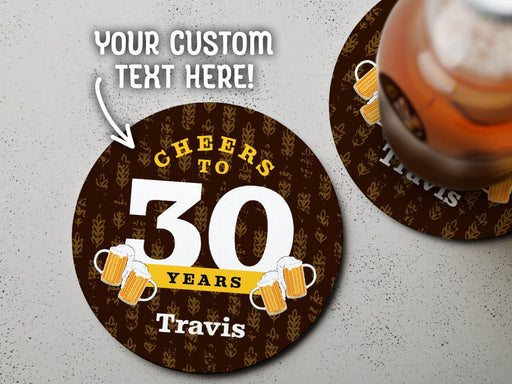 One coaster has a drink on it and an empty coaster sits beside it on a grey background. Text above coasters say your custom text here! Coasters say Cheers to 30 Years, Travis!
