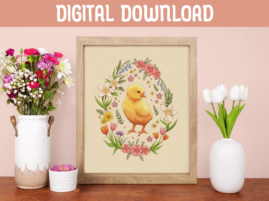 wooden frame with easter print of a baby chick surrounded by spring flowers on a wooden table in front of a pink wall surrounded by colorful potted flowers