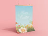 hanging poster of happy easter print with a colorful meadow of spring flowers in front of light pink background