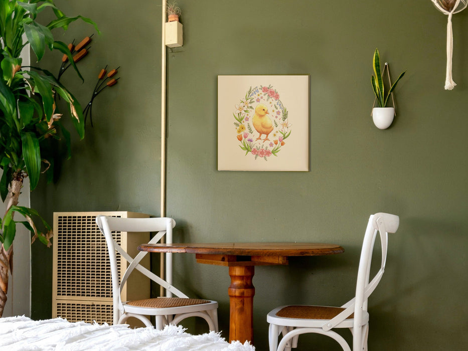 12x12 inch canvas with spring easter chick pastel easter art on green bedroom wall hanging over a wooden table with two white chairs surrounded by house plants and a white bed mattress